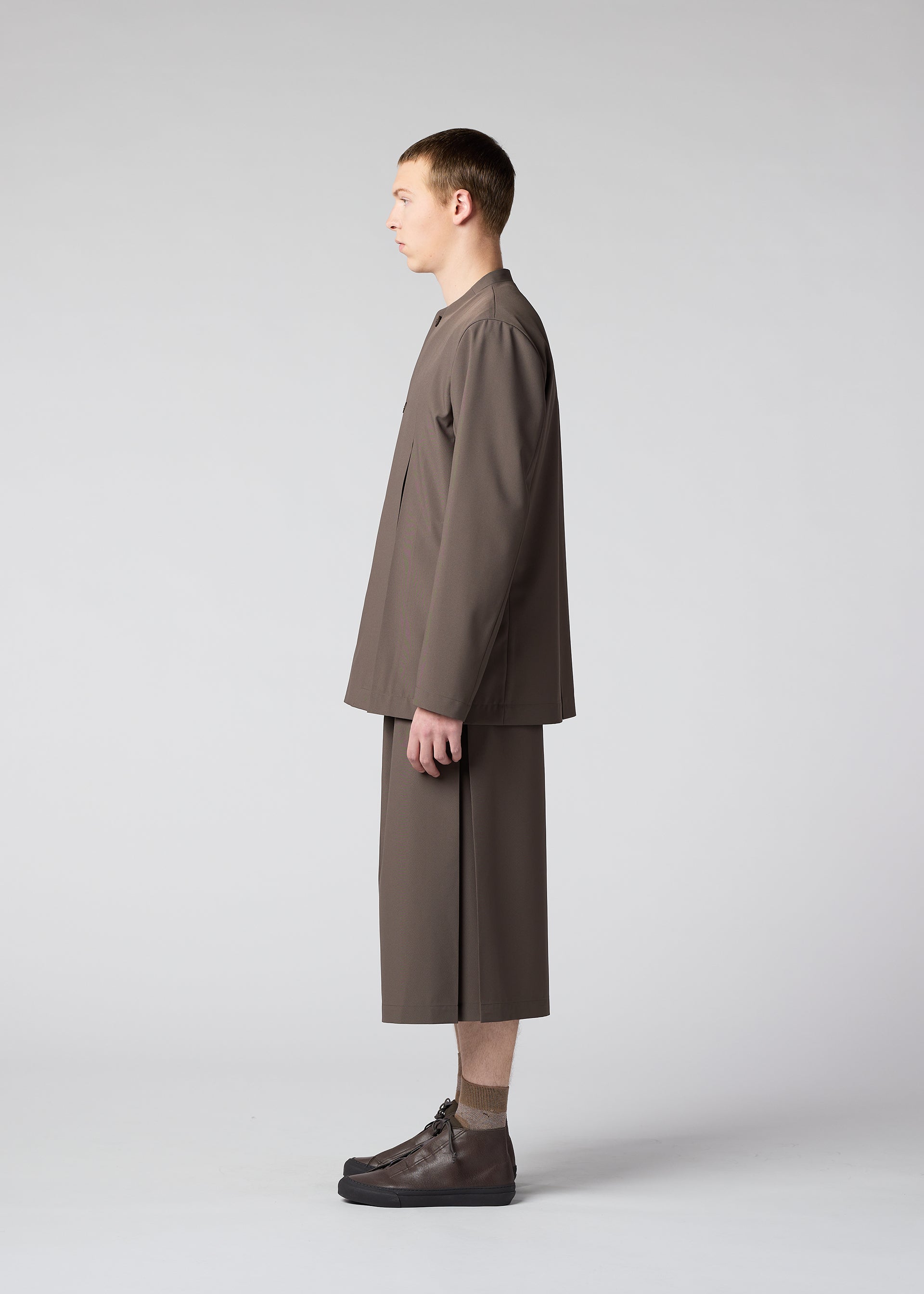 A model wears the IM MEN WINGS trousers.
