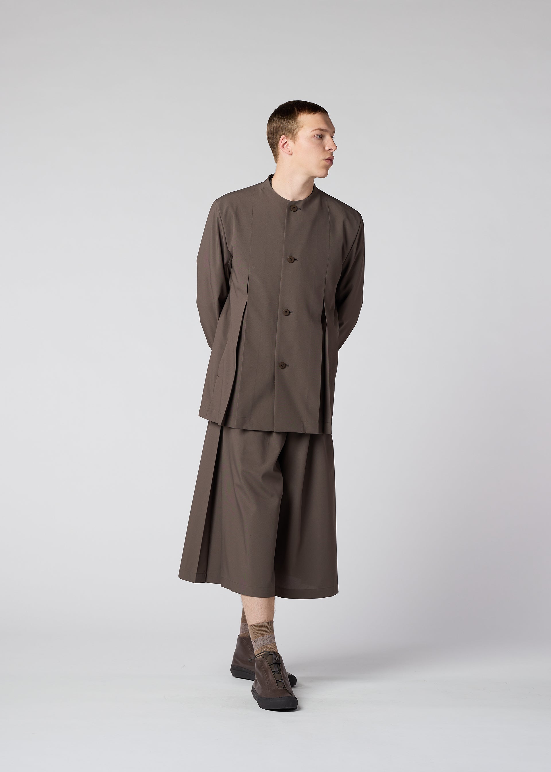 A model wears the IM MEN WINGS trousers.