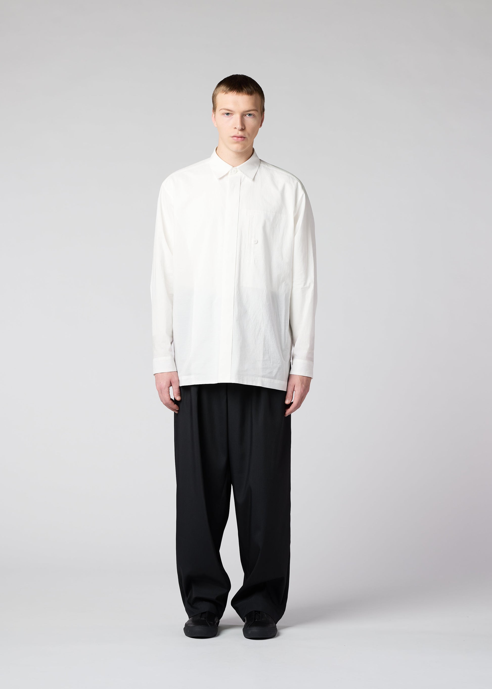 A model wears the IM MEN WHITE SHIRT shirt.
