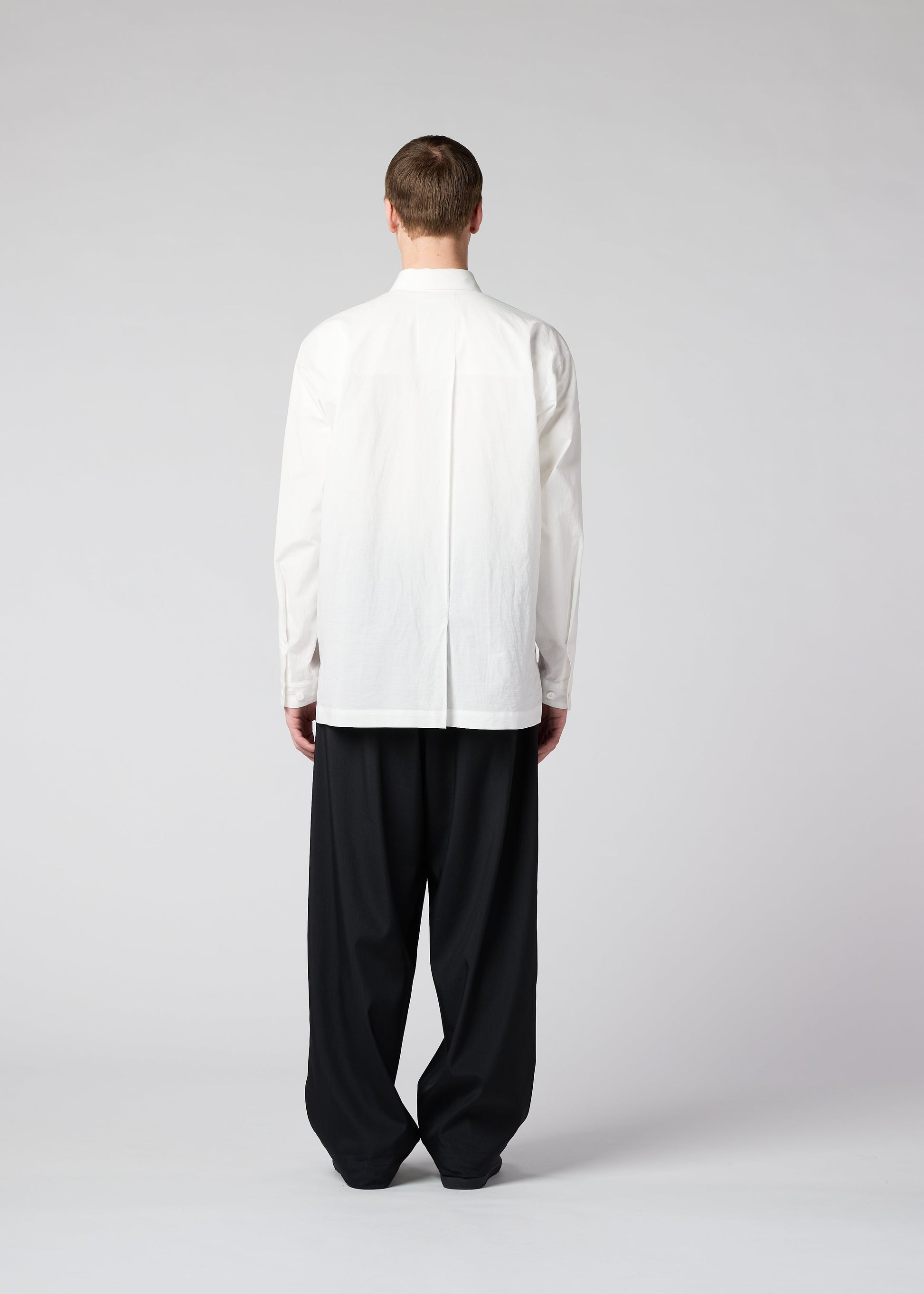 A model wears the IM MEN WHITE SHIRT shirt.