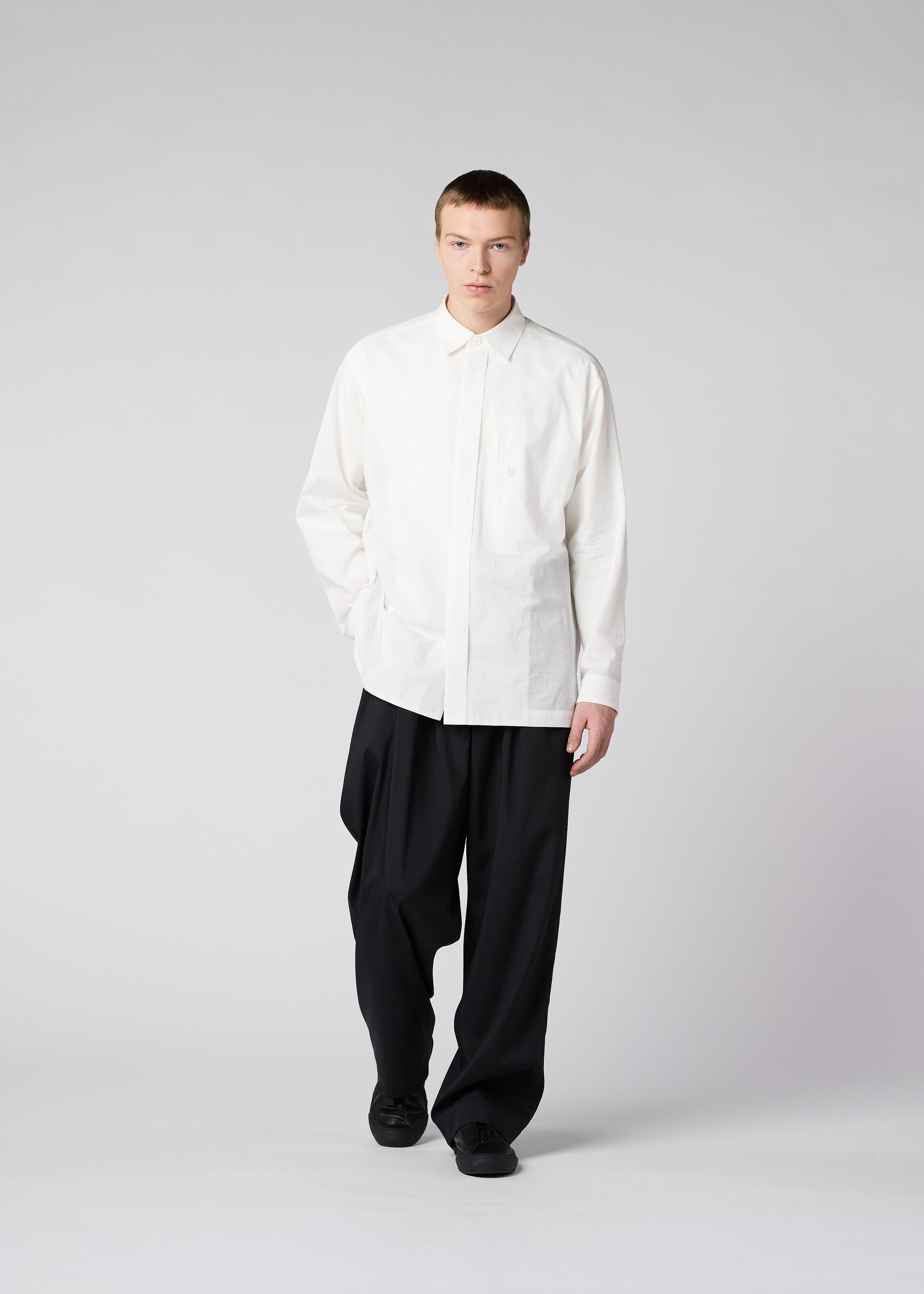 A model wears the IM MEN WHITE SHIRT shirt.