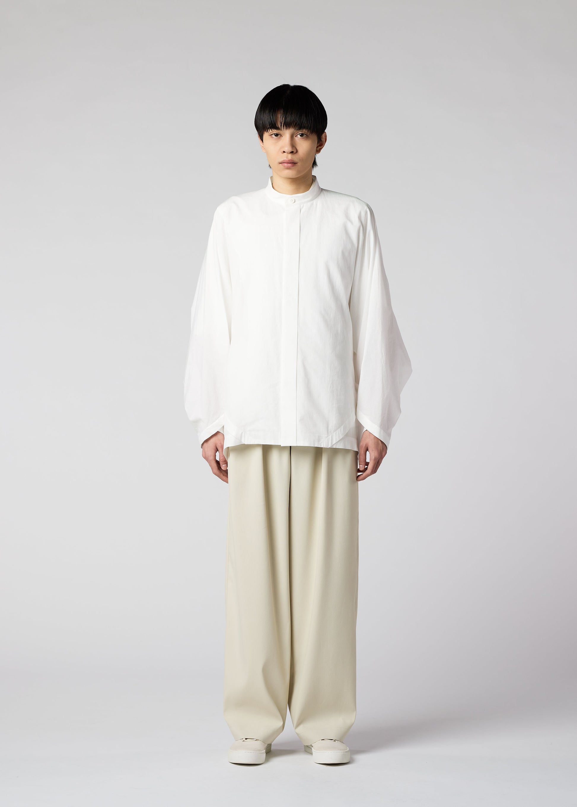 A model wears the IM MEN WHITE SHIRT shirt.