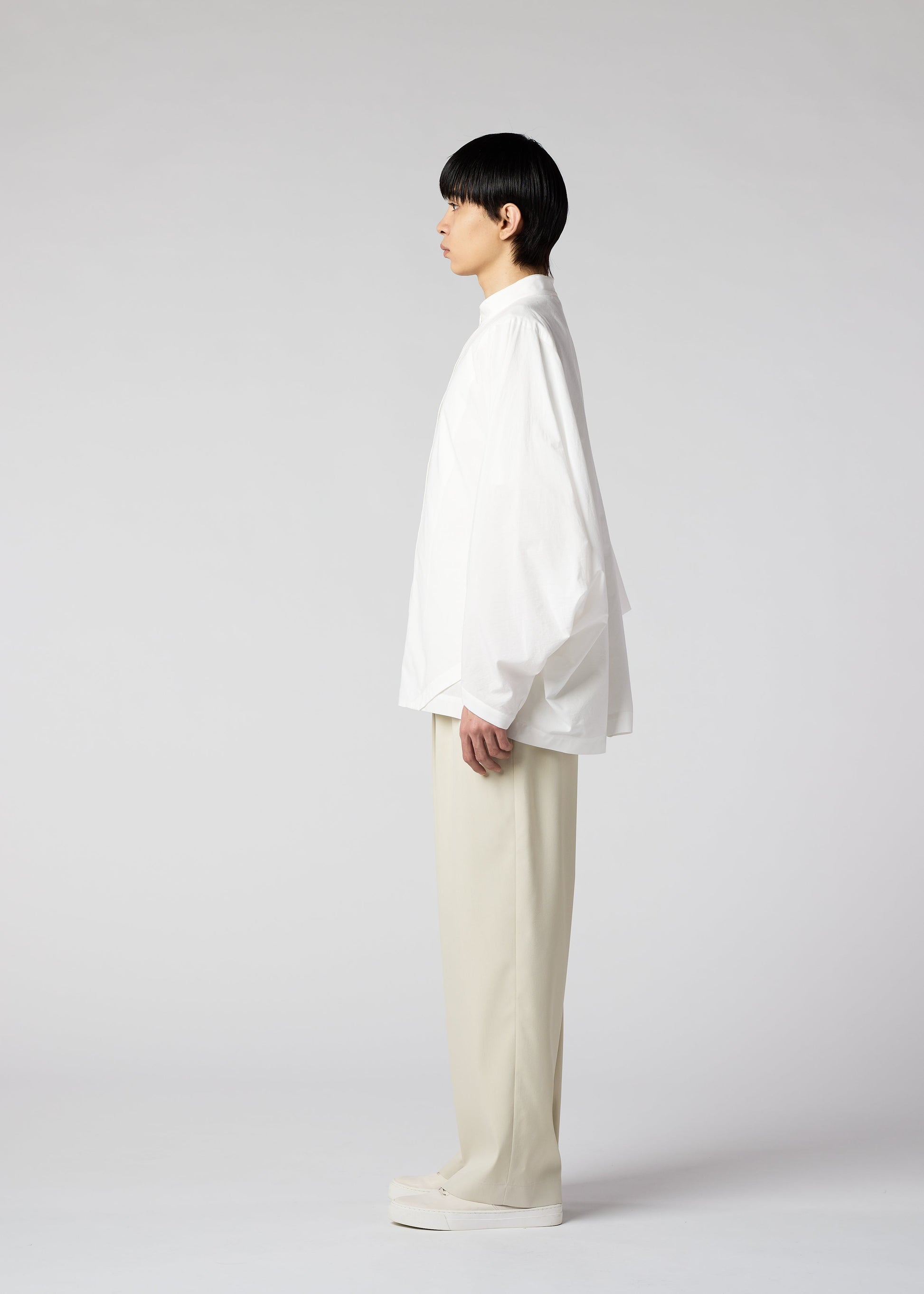 A model wears the IM MEN WHITE SHIRT shirt.