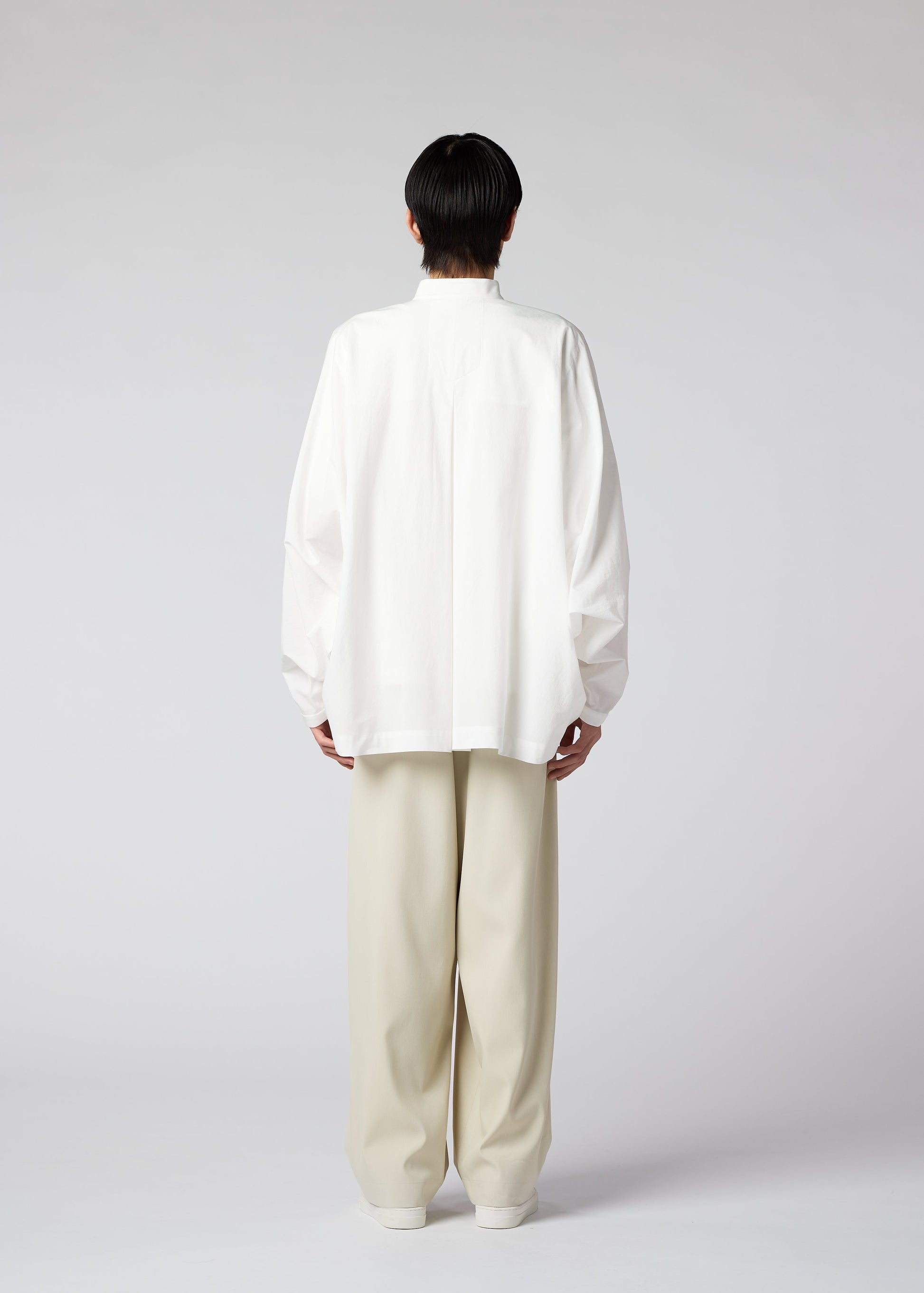 A model wears the IM MEN WHITE SHIRT shirt.