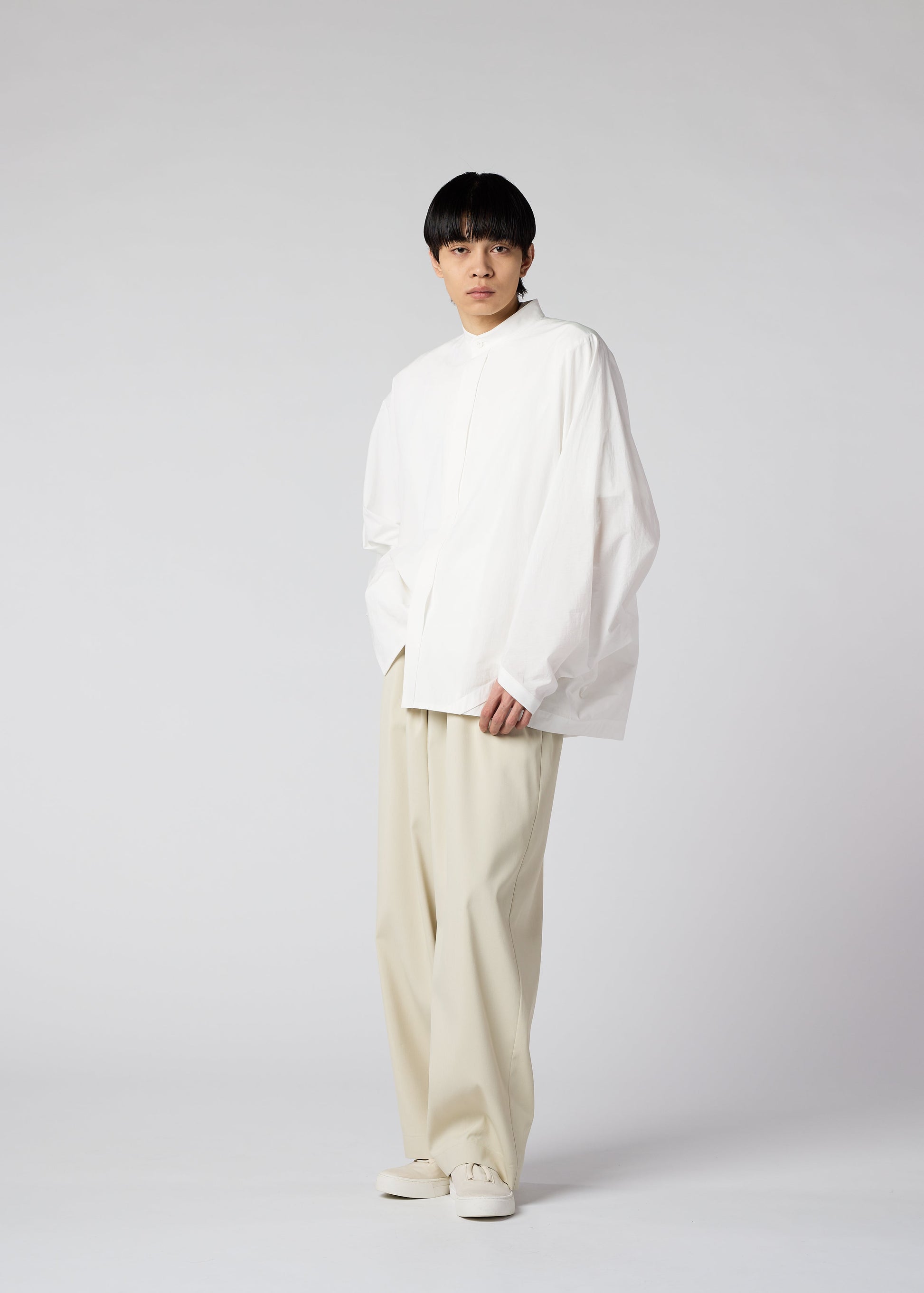 A model wears the IM MEN WHITE SHIRT shirt.