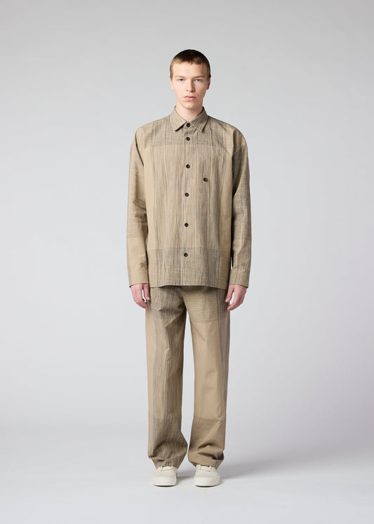 A model wears the IM MEN KASURI shirt.