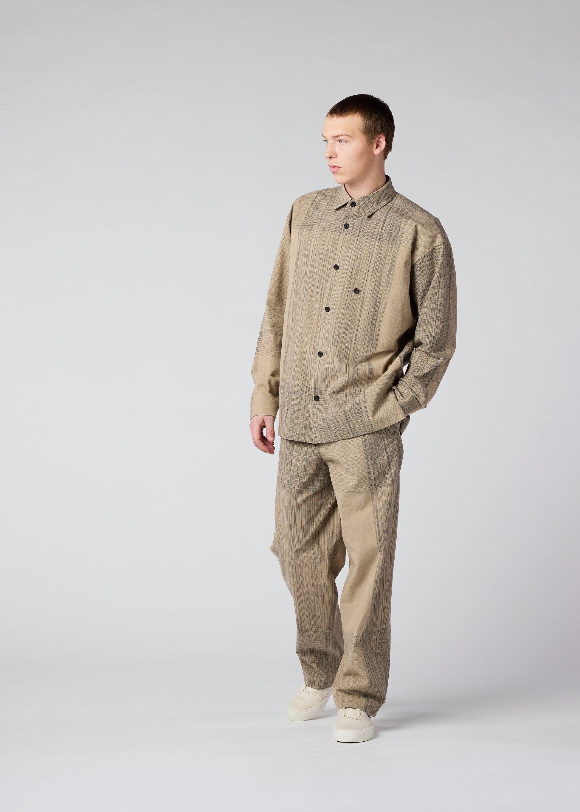 A model wears the IM MEN KASURI shirt.