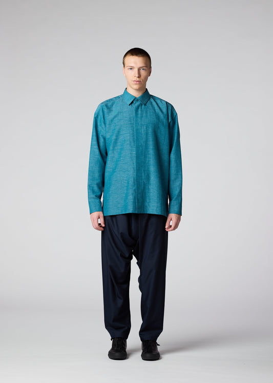 A model wears the IM MEN HYBRID SHIRT shirt.