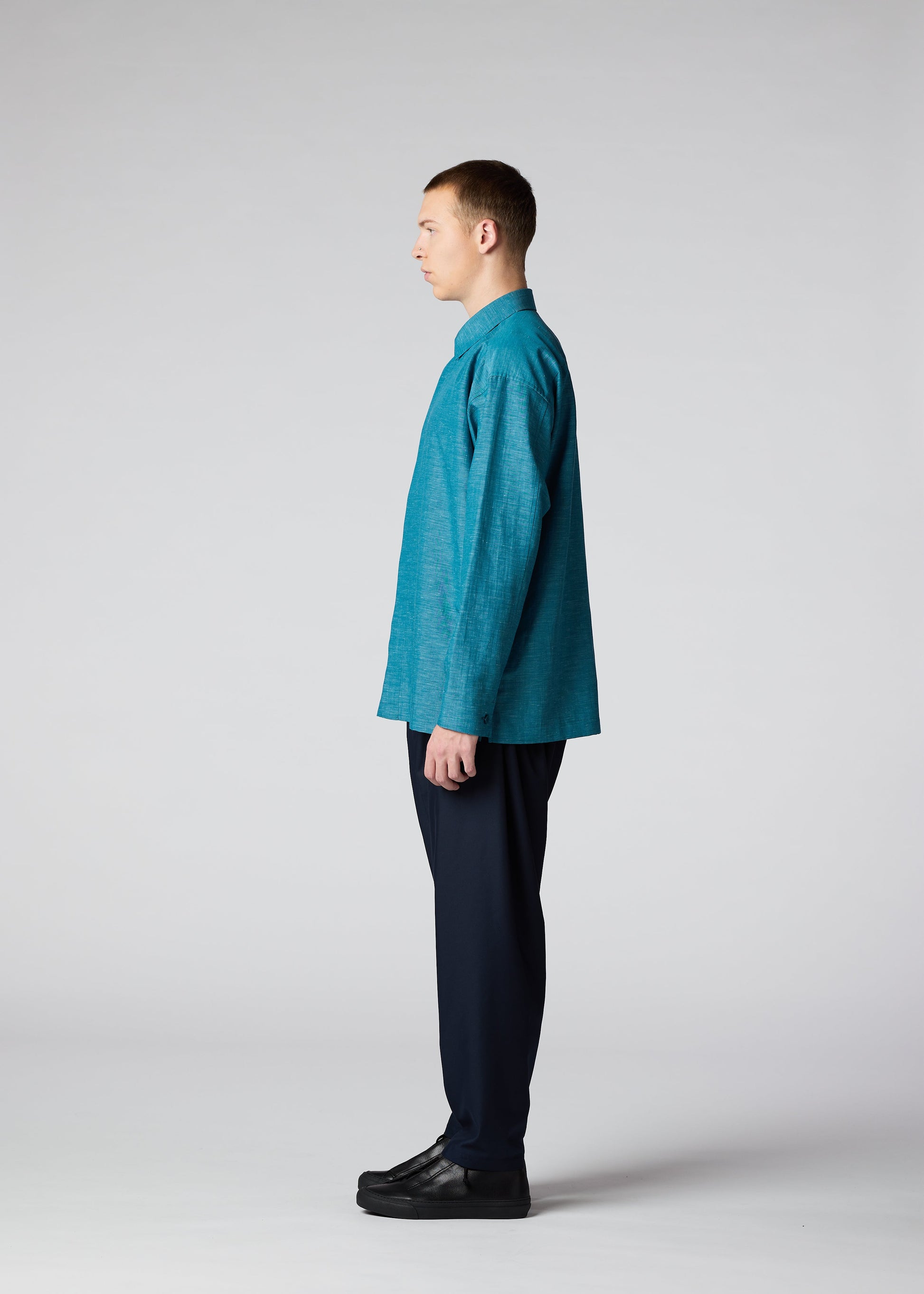 A model wears the IM MEN HYBRID SHIRT shirt.