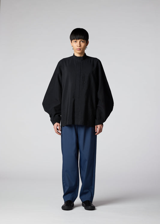 A model wears the IM MEN HYBRID SHIRT shirt.