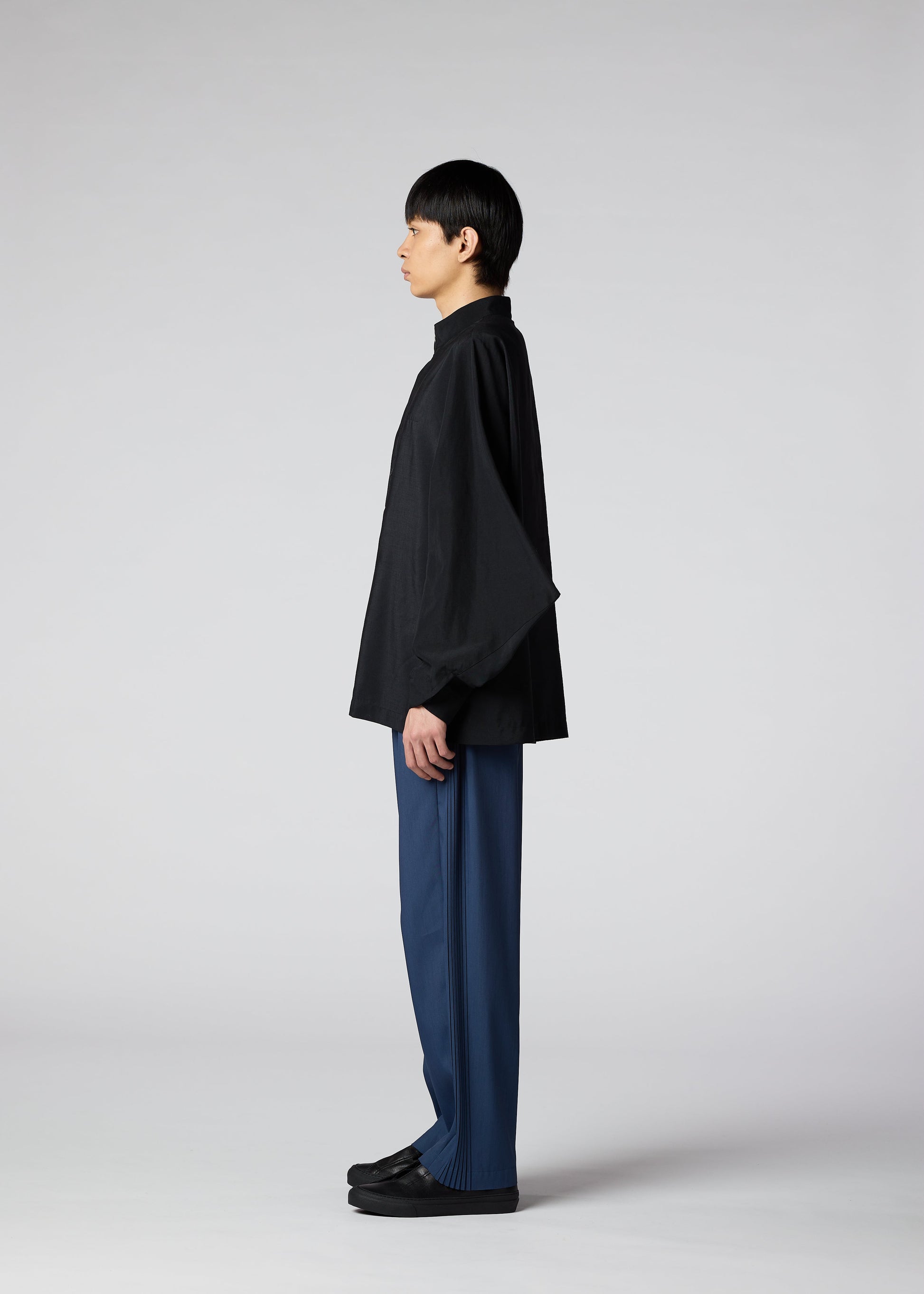 A model wears the IM MEN HYBRID SHIRT shirt.