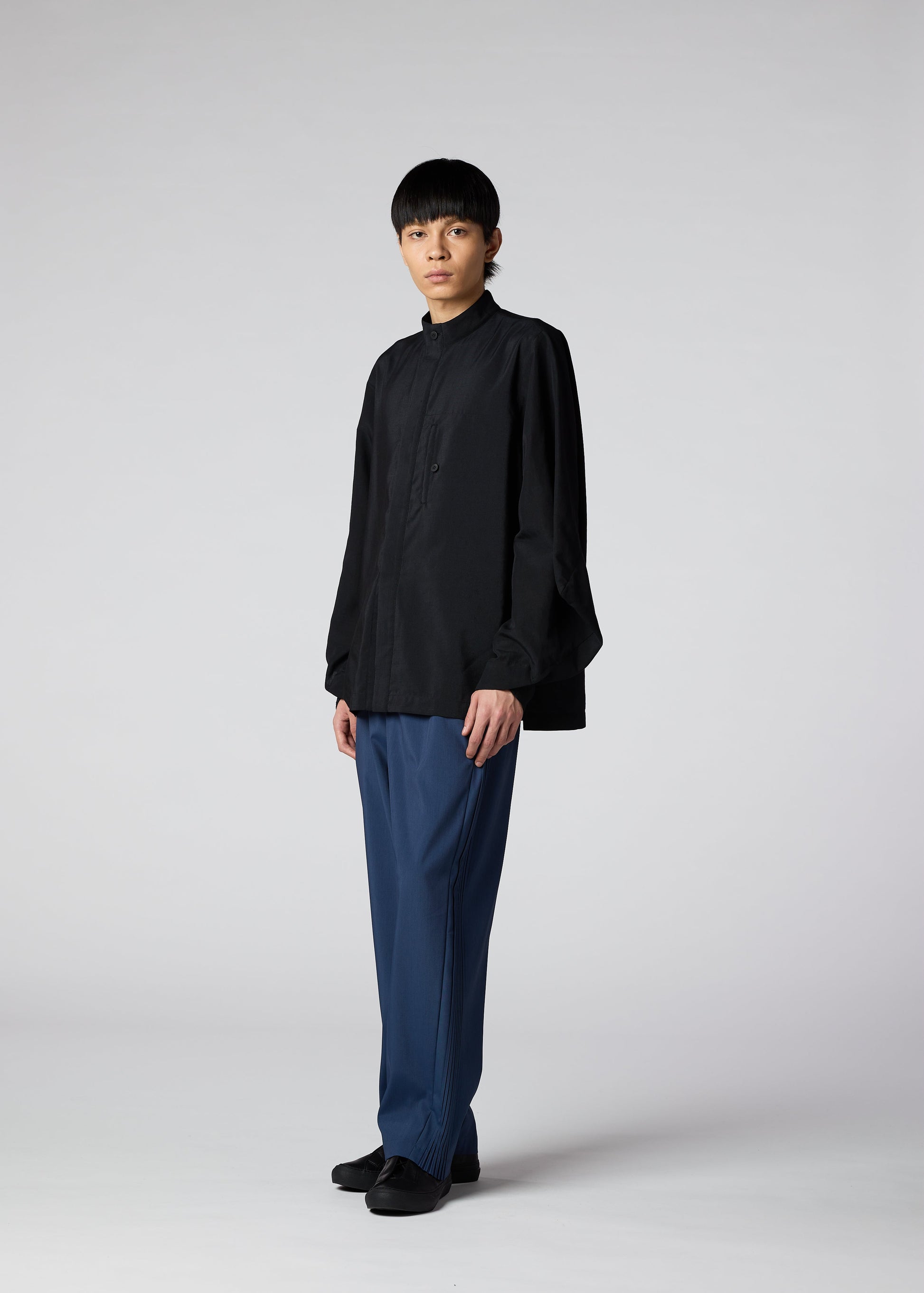 A model wears the IM MEN HYBRID SHIRT shirt.