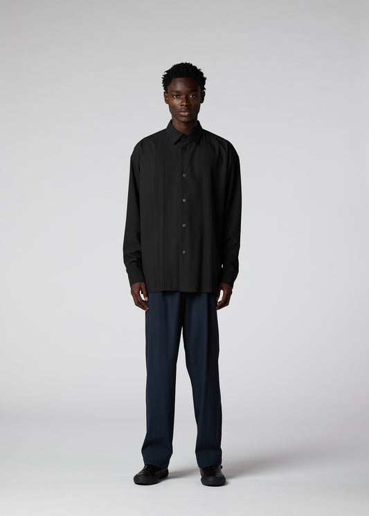 A model wears the IM MEN PLEATS SHIRT shirt.