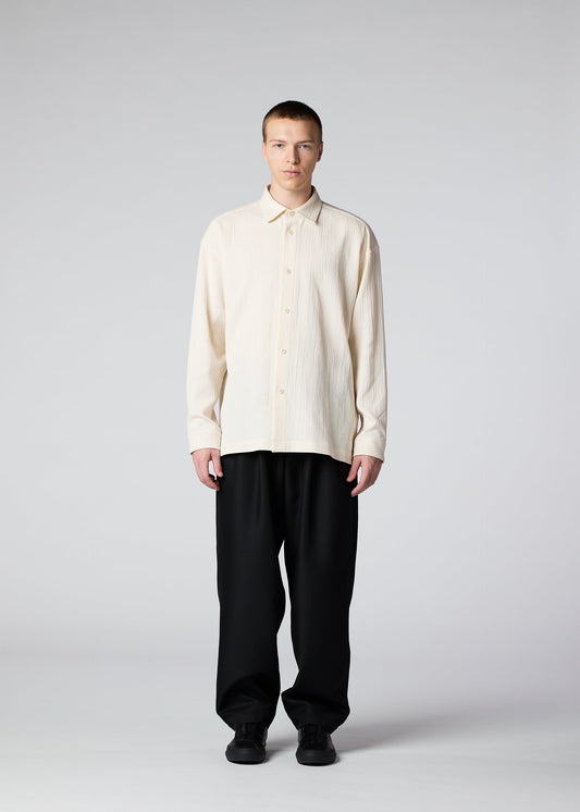 A model wears the IM MEN DOUBLE WEAVE CREPE shirt.
