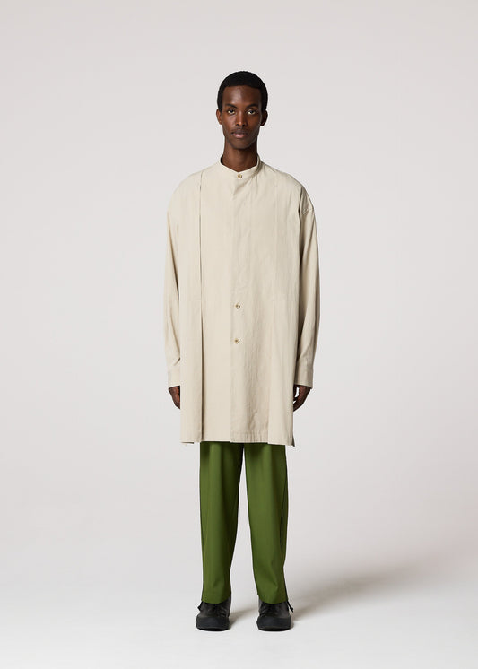 A model wears the IM MEN WHITE SHIRT clothing.
