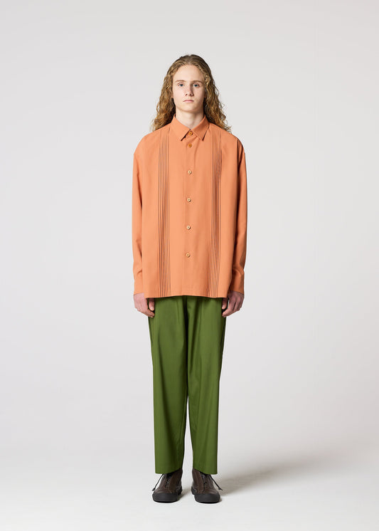 A model wears the IM MEN PLEATS SHIRT shirt.