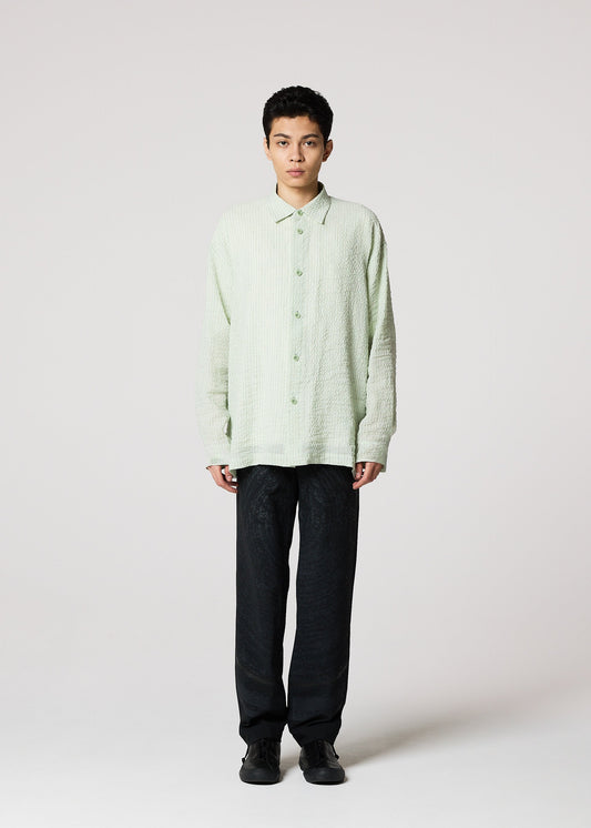A model wears the IM MEN STRIPE LINEN SHRINK shirt.