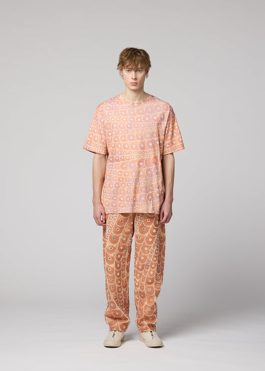 A model wears the IM MEN UROKOMON T top.