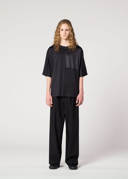 A model wears the IM MEN FLAT T top.
