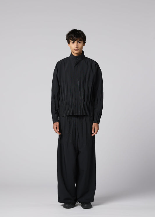 A model wears the IM MEN WAFT BLACK waft-black-trousers-black-2.