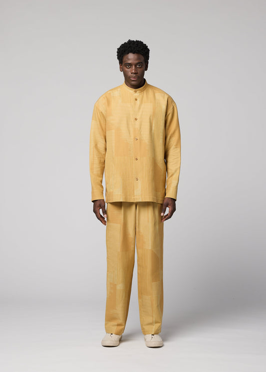 A model wears the IM MEN KASURI kasuri-straight-leg-trousers-black.