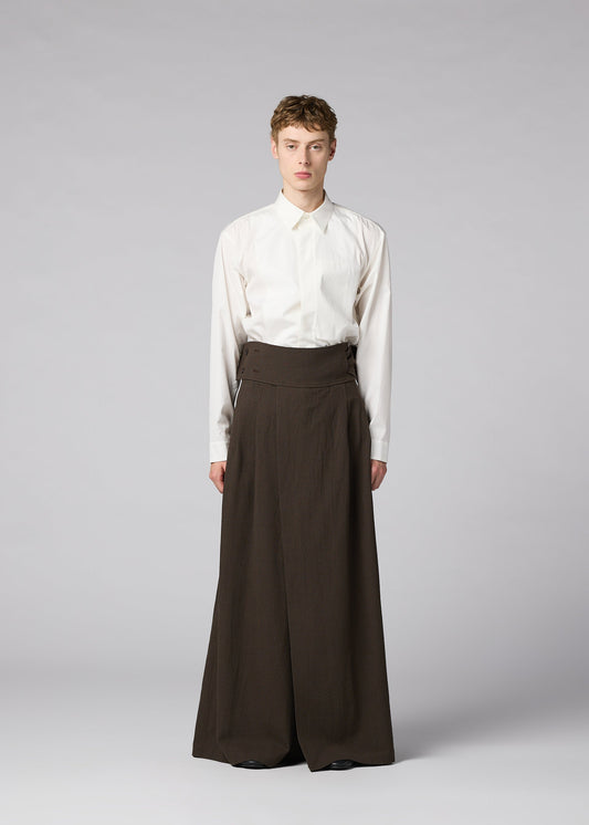 A model wears the IM MEN SHRINK WOOL shrink-wool-trousers-black.