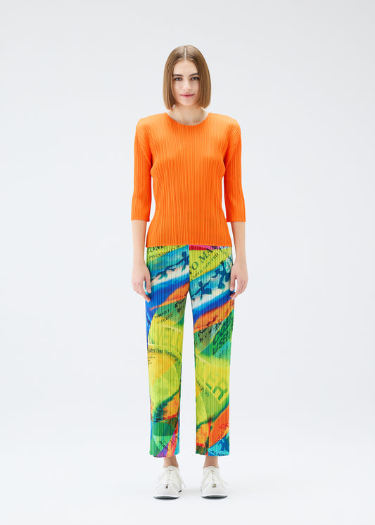 A model wears the PLEATS PLEASE ISSEY MIYAKE VOYAGER trousers