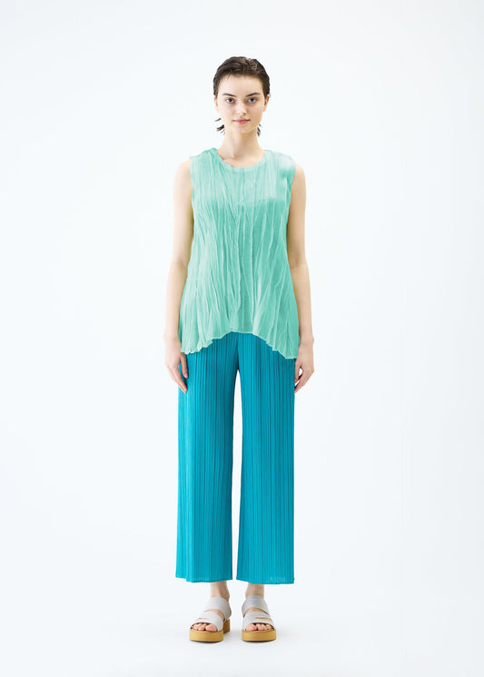 A model wears the PLEATS PLEASE ISSEY MIYAKE SHEER TWIST top.