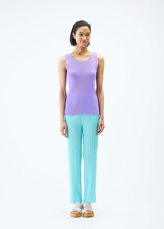 A model wears the PLEATS PLEASE ISSEY MIYAKE MIST APRIL top.