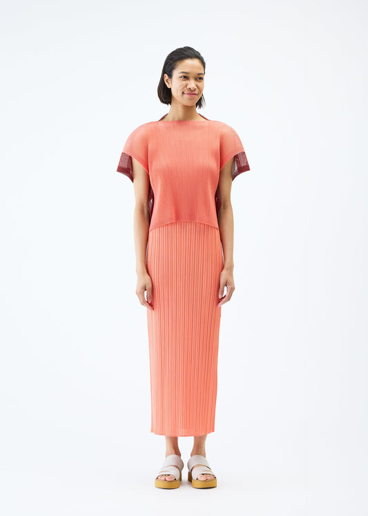A model wears the PLEATS PLEASE ISSEY MIYAKE SHEER SQUARE top.