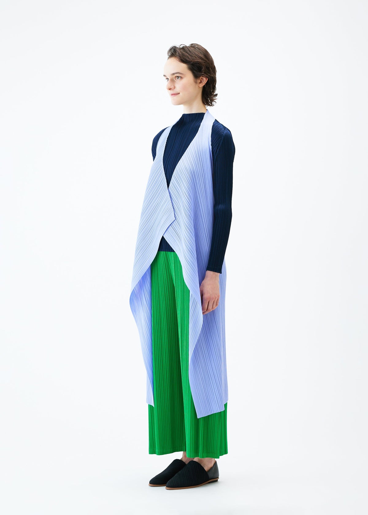 A model wears the PLEATS PLEASE ISSEY MIYAKE MONTHLY COLORS FEBRUARY vest.