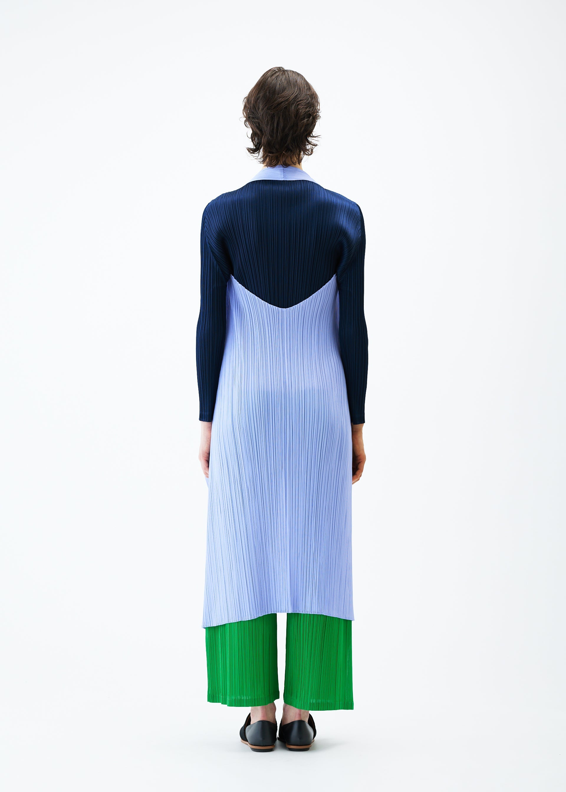 A model wears the PLEATS PLEASE ISSEY MIYAKE MONTHLY COLORS FEBRUARY vest.
