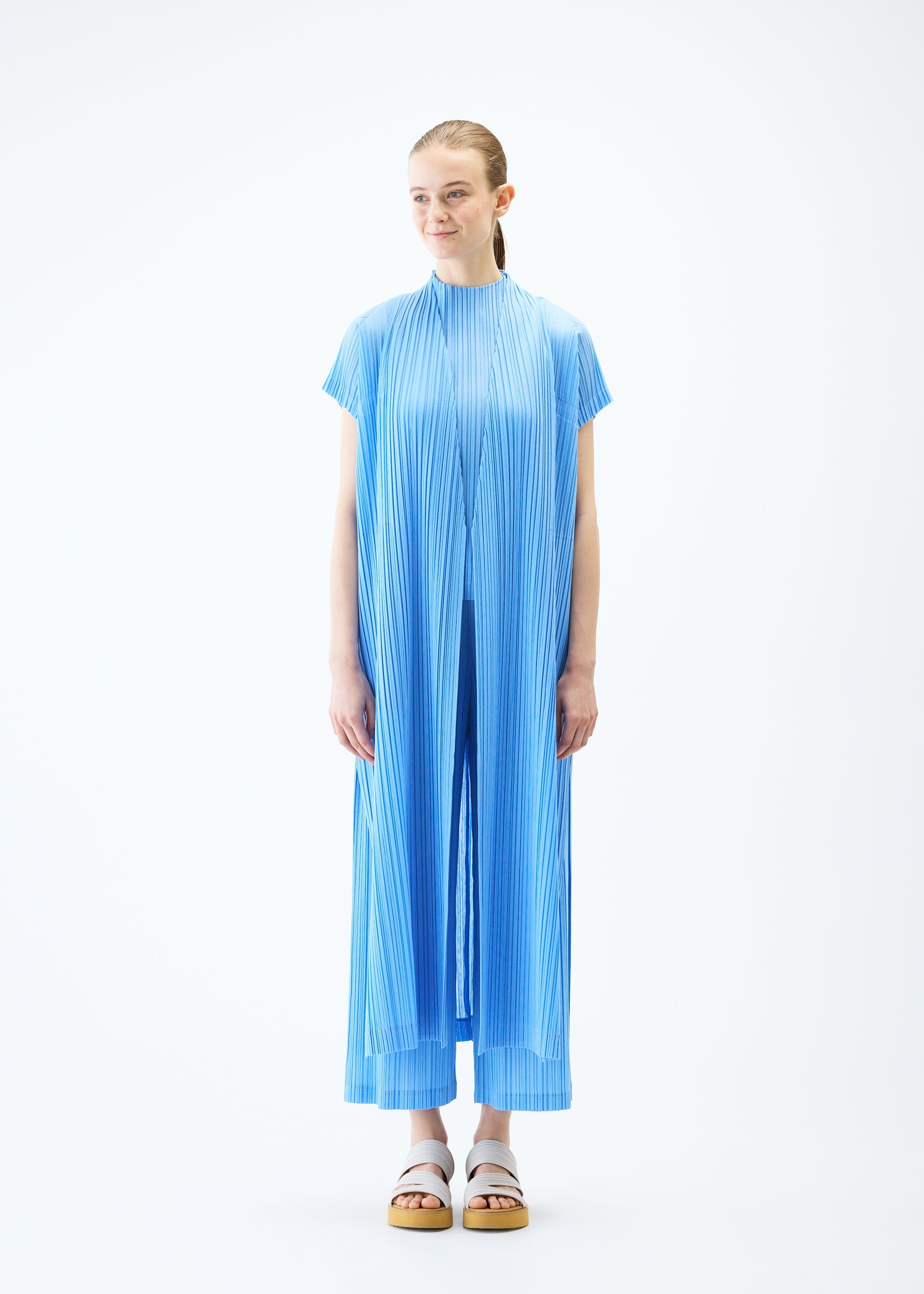 A model wears the PLEATS PLEASE ISSEY MIYAKE RAMIE PLEATS vest.