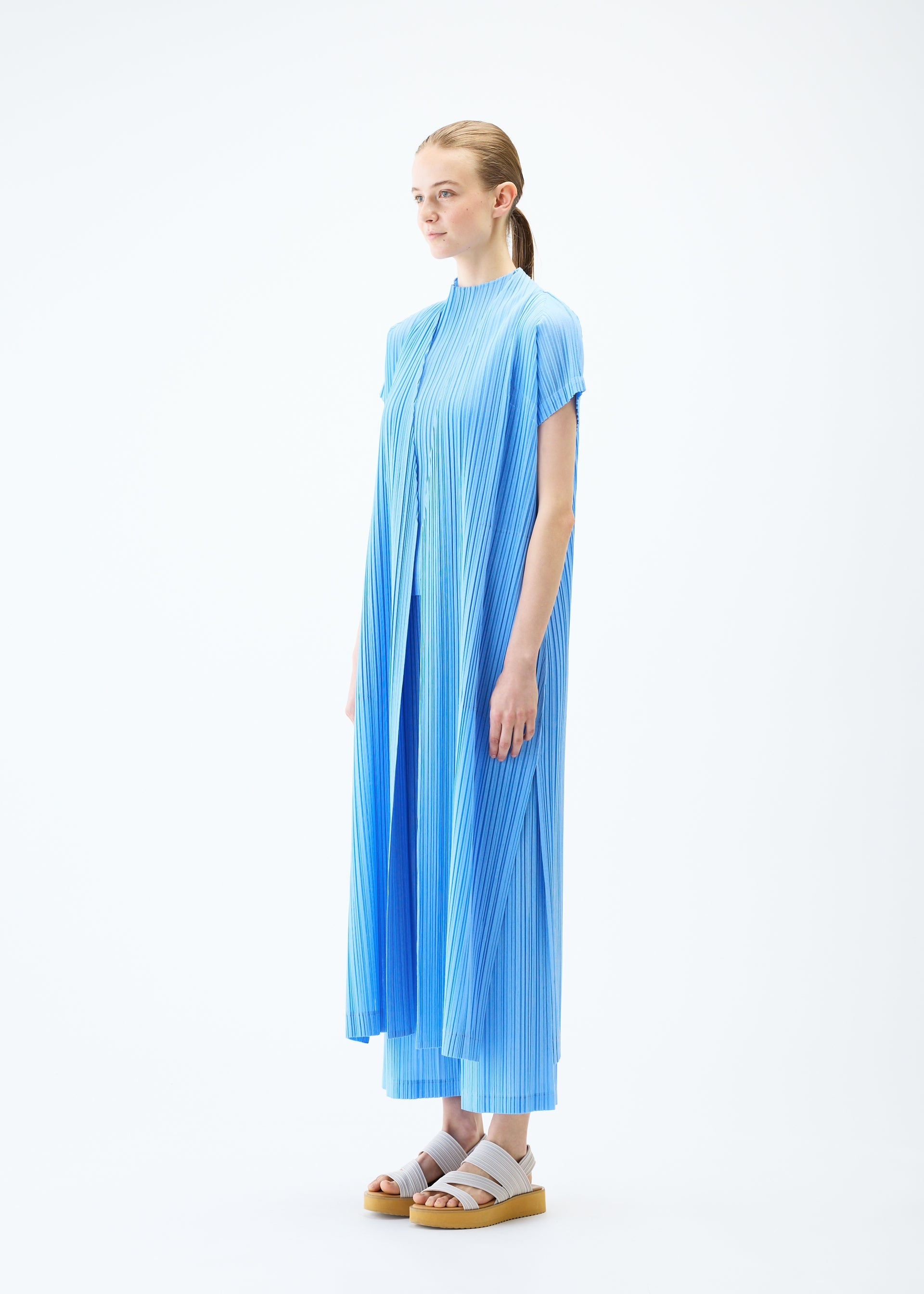 A model wears the PLEATS PLEASE ISSEY MIYAKE RAMIE PLEATS vest.