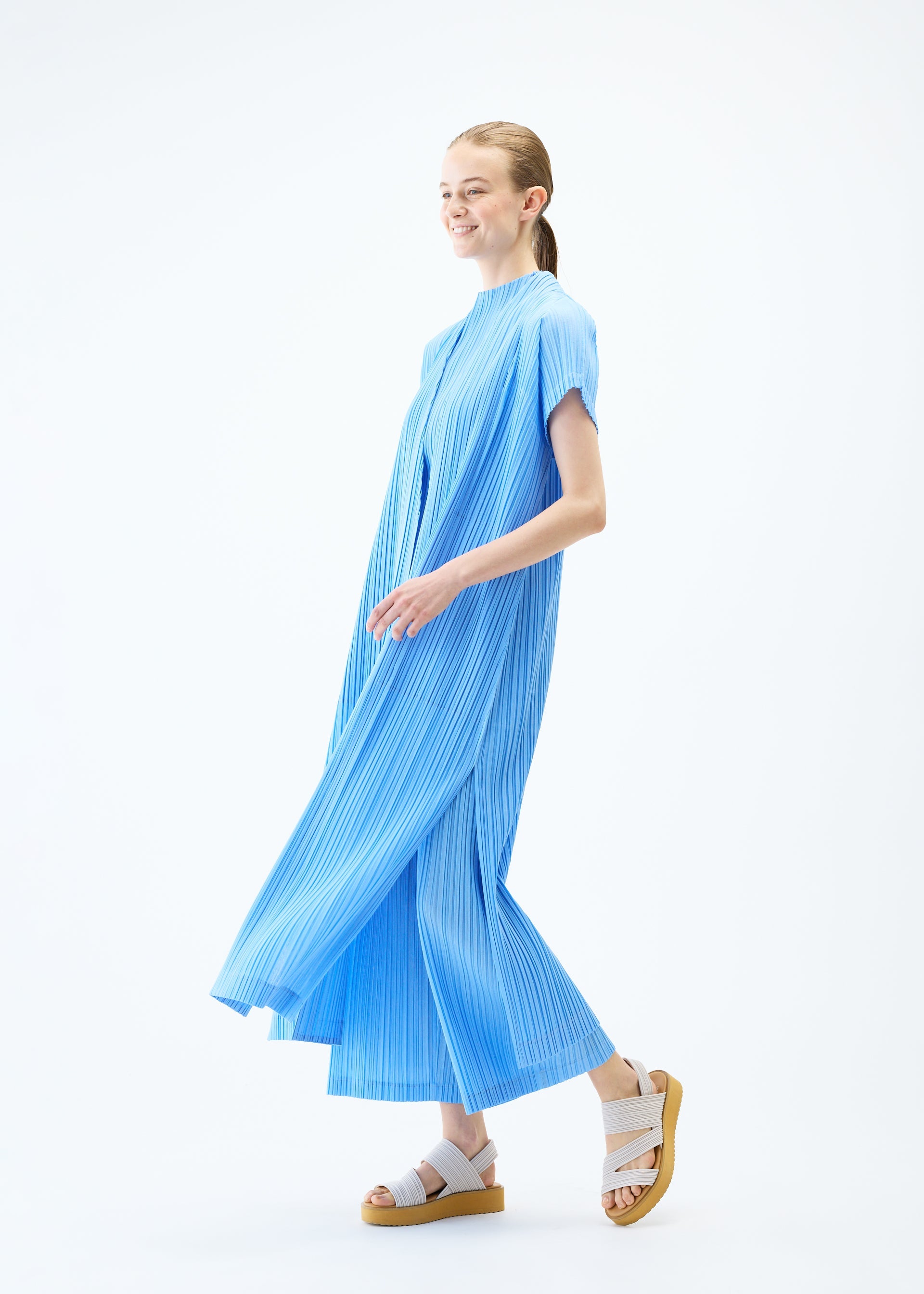 A model wears the PLEATS PLEASE ISSEY MIYAKE RAMIE PLEATS vest.
