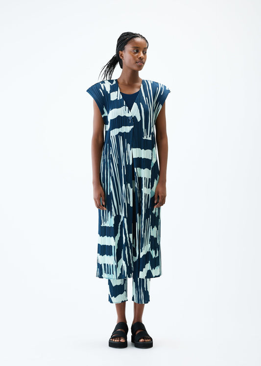 A model wears the PLEATS PLEASE ISSEY MIYAKE REFRACTION vest.