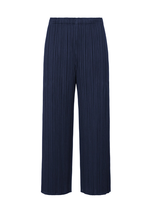 A product shot of the PLEATS PLEASE ISSEY MIYAKE MERRY BICOLOR trousers in navy (75).