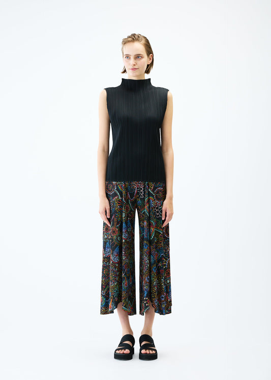 A model wears the PLEATS PLEASE ISSEY MIYAKE LIGHT FESTIVAL trousers.
