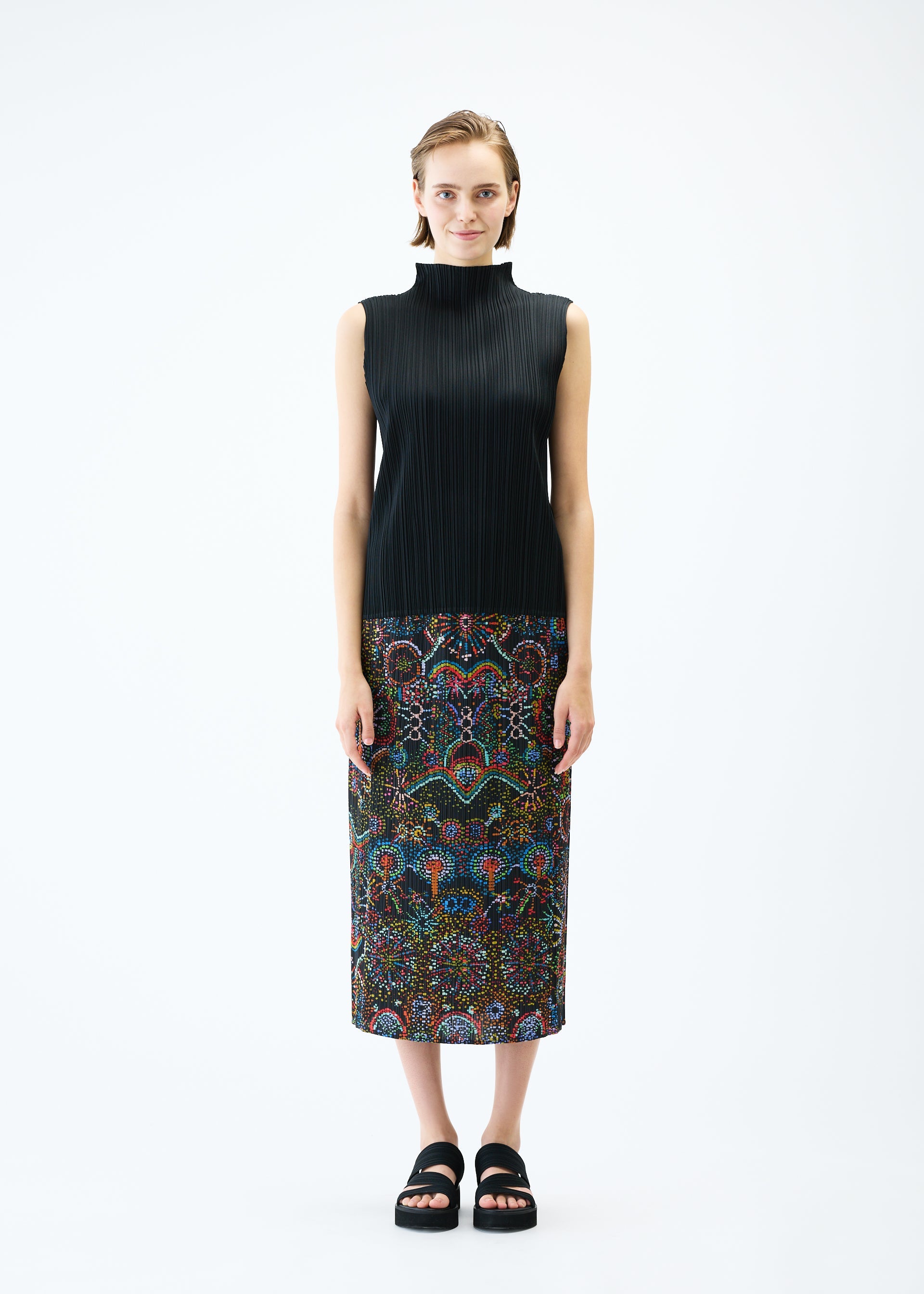A model wears the PLEATS PLEASE ISSEY MIYAKE LIGHT FESTIVAL skirt.