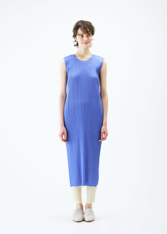 A model wears the PLEATS PLEASE ISSEY MIYAKE MONTHLY COLORS MARCH dress.