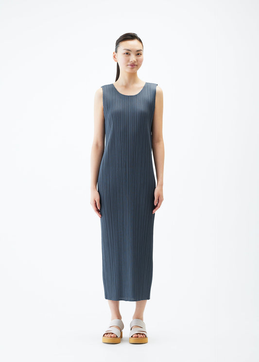 A model wears the PLEATS PLEASE ISSEY MIYAKE MONTHLY COLORS MAY dress.