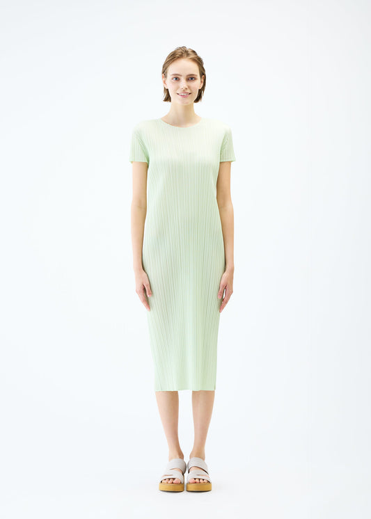 A model wears the PLEATS PLEASE ISSEY MIYAKE MONTHLY COLORS : JUNE dress.