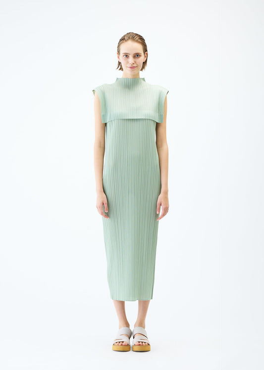 A model wears the PLEATS PLEASE ISSEY MIYAKE MONTHLY COLORS : JUNE dress.