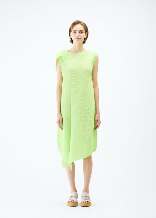 A model wears the PLEATS PLEASE ISSEY MIYAKE FLARE dress.