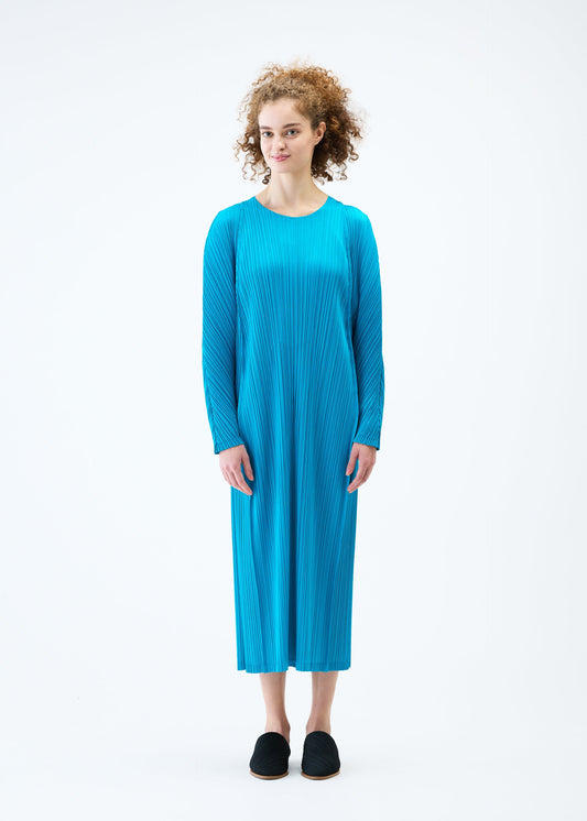 A model wears the PLEATS PLEASE ISSEY MIYAKE LANTERN dress.