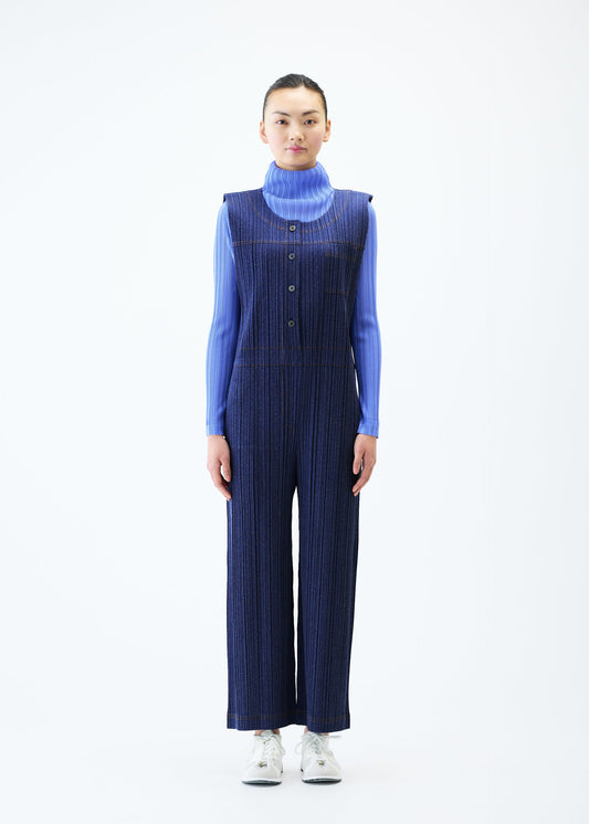 A model wears the PLEATS PLEASE ISSEY MIYAKE COTTON DENIM jumpsuit.