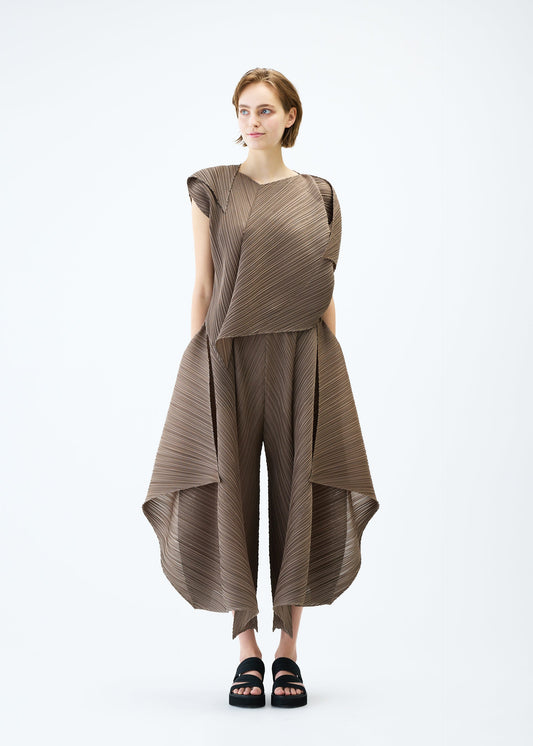A model wears the PLEATS PLEASE ISSEY MIYAKE FLARE top.