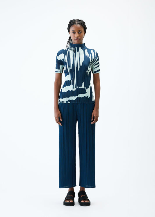 A model wears the PLEATS PLEASE ISSEY MIYAKE REFRACTION top.