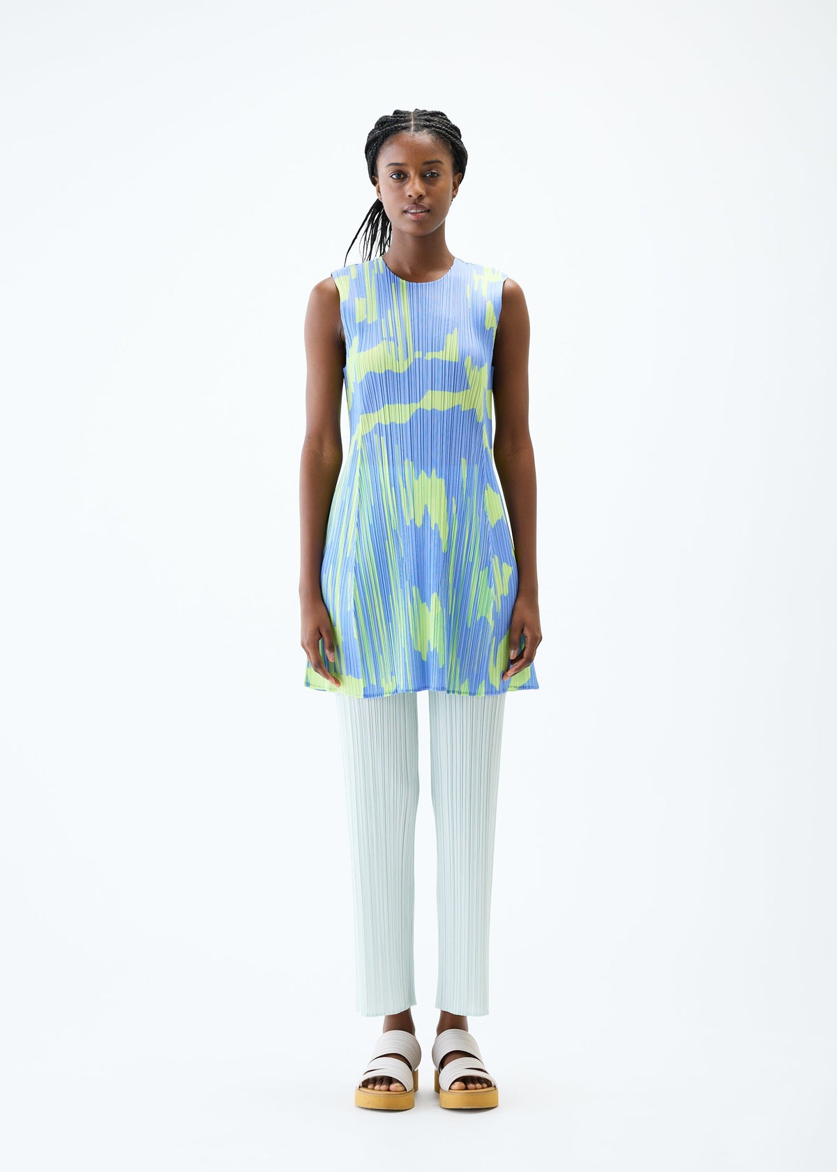 A model wears the PLEATS PLEASE ISSEY MIYAKE REFRACTION tunic.