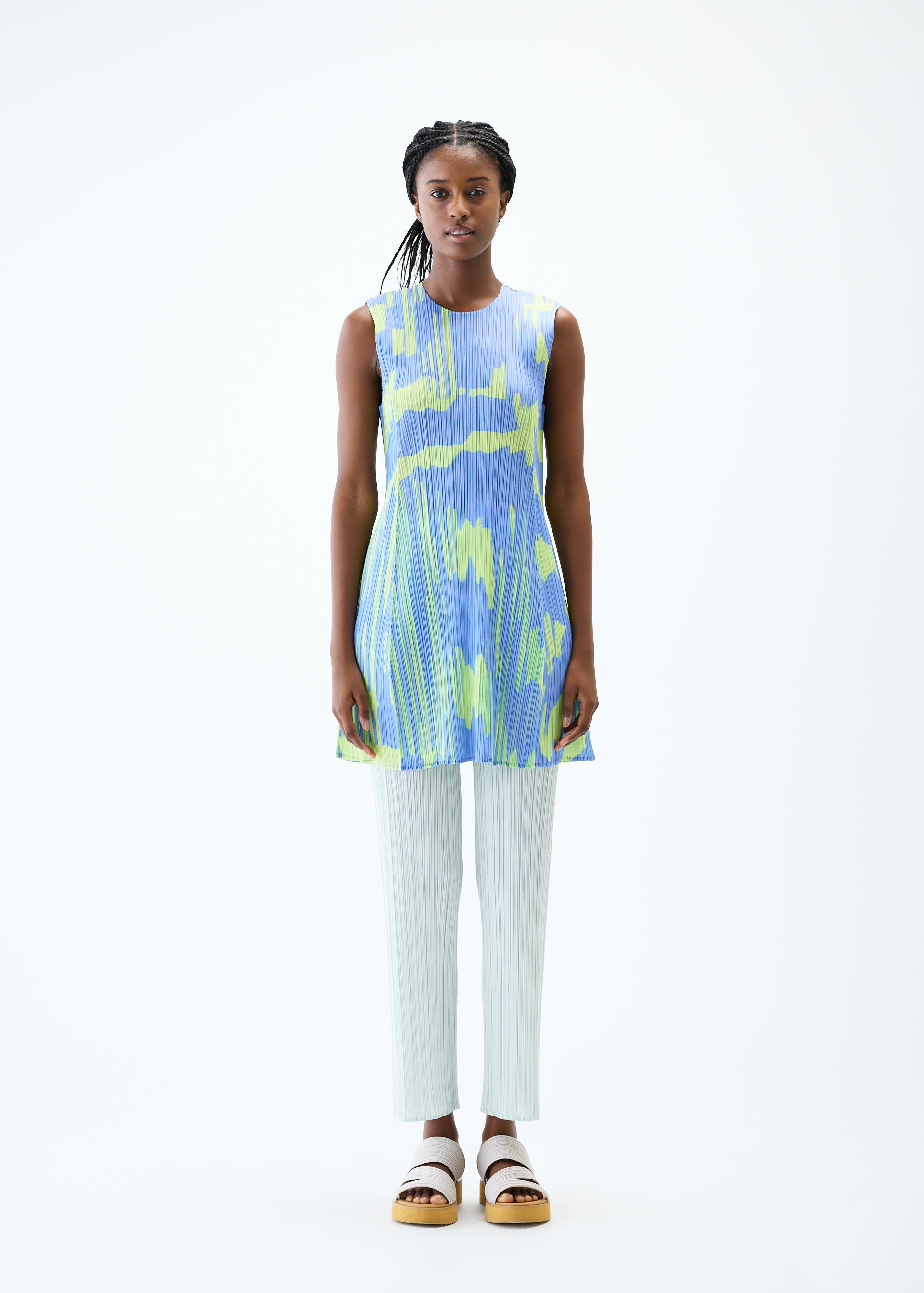 A model wears the PLEATS PLEASE ISSEY MIYAKE REFRACTION tunic.